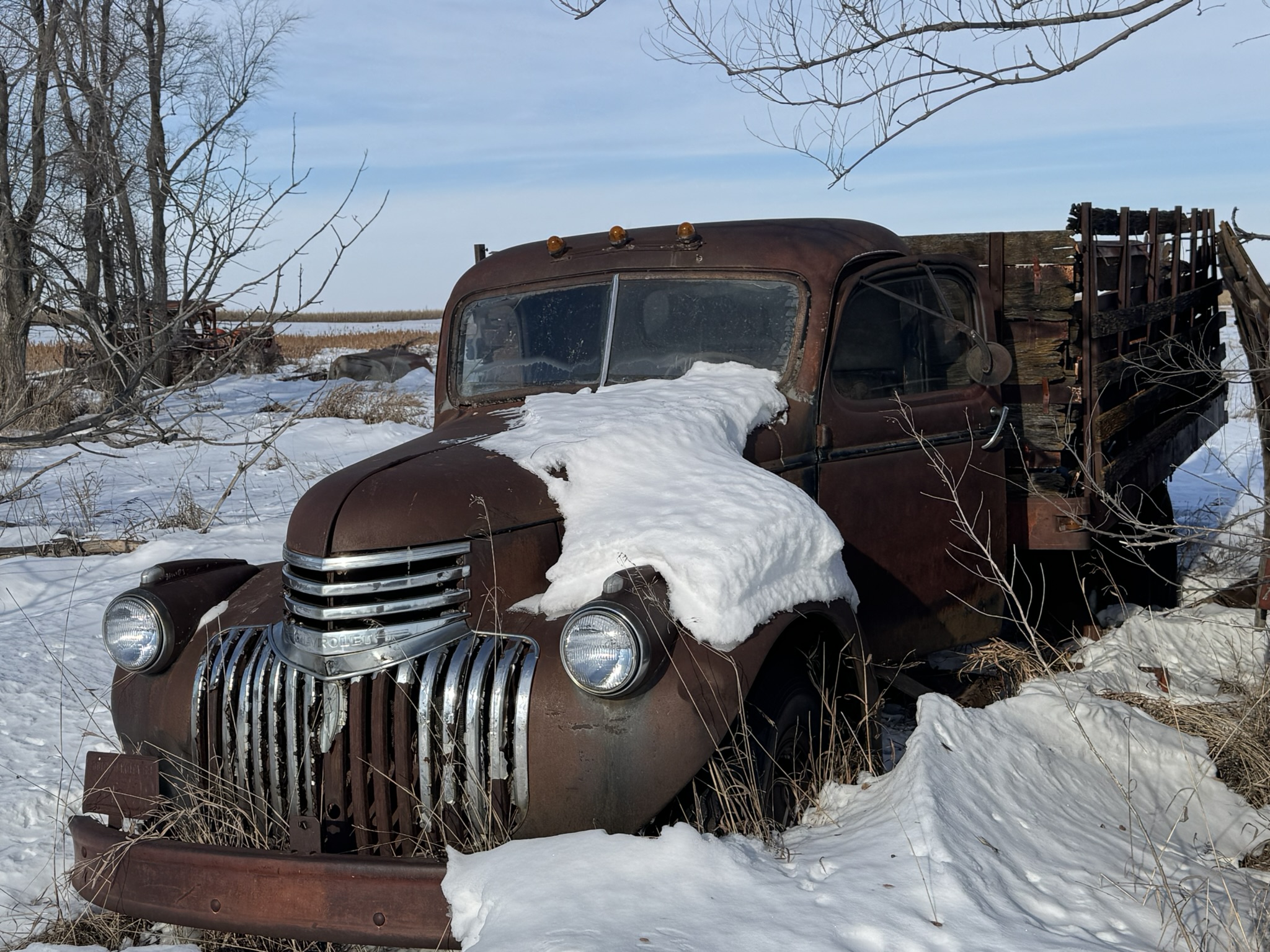 South Dakota pheasant hunting lodge — old truck in the snow at Half Cocked Lodge